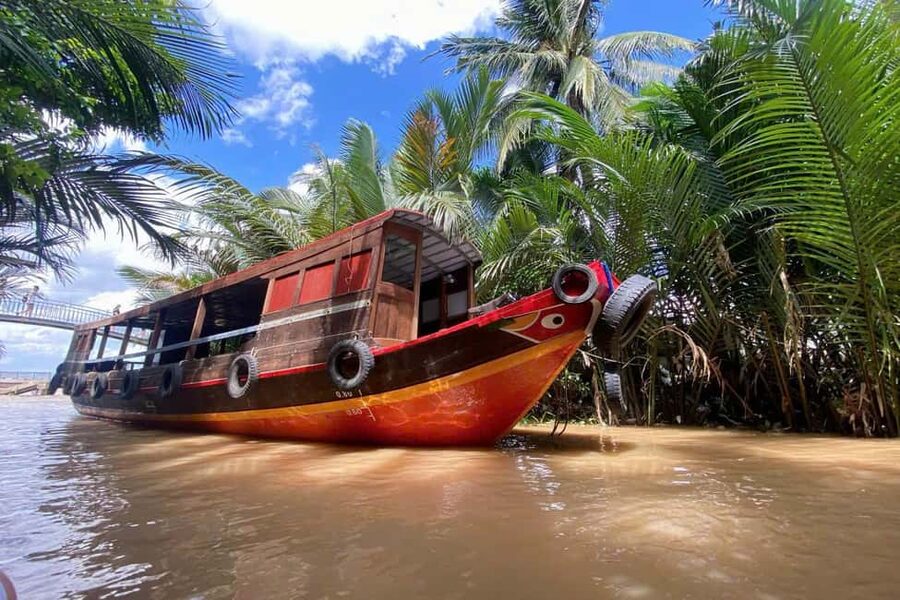 Authentic Mekong Delta: Tuk Tuk, Rowing Boat, Biking Tour - A motorboat across the Tien River