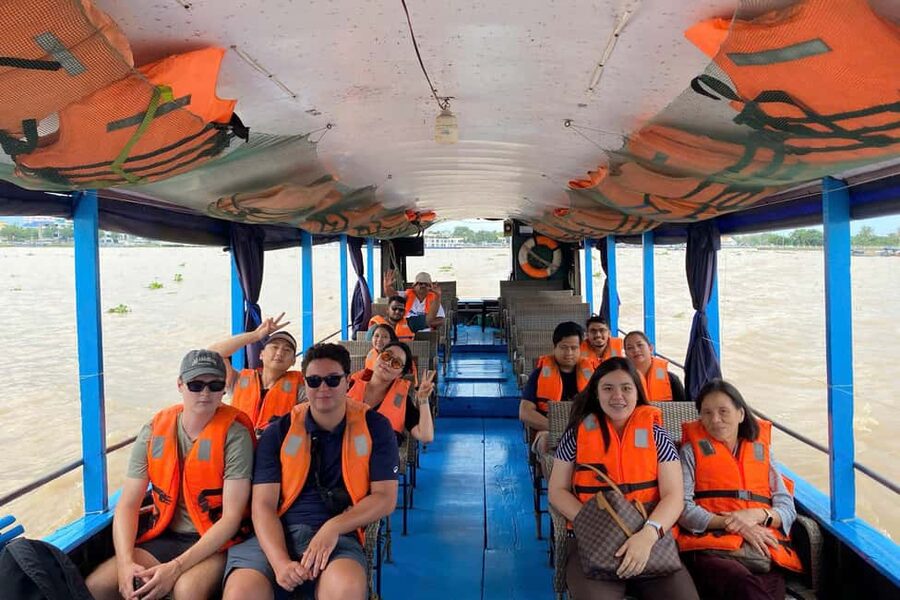 Authentic Mekong Delta: Tuk Tuk, Rowing Boat, Biking Tour - Rowing beneath the water coconut palms