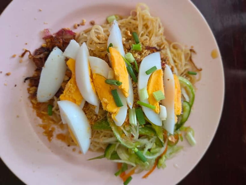 Battambang: Morning Tuk Tuk Food Tour of Our Iconic Dishes - Nom banh chok beside a stilted home