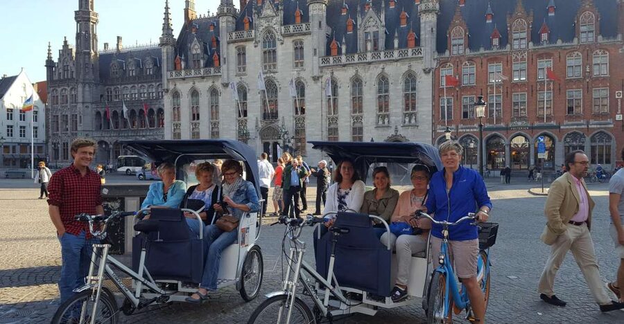 Bruges: Guided Rickshaw Tour - From Famous Buildings to Quieter Streets