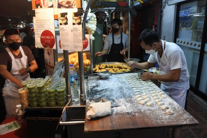 Chinatown Street Food Night Tour by Tuk Tuk in Bangkok - Wat Ratchanatdaram and the Grand Palace view