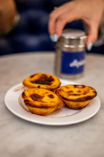 Lisbon: Food Tasting Tour by Tuk Tuk with 2 Stops - The guides are a major part of the value