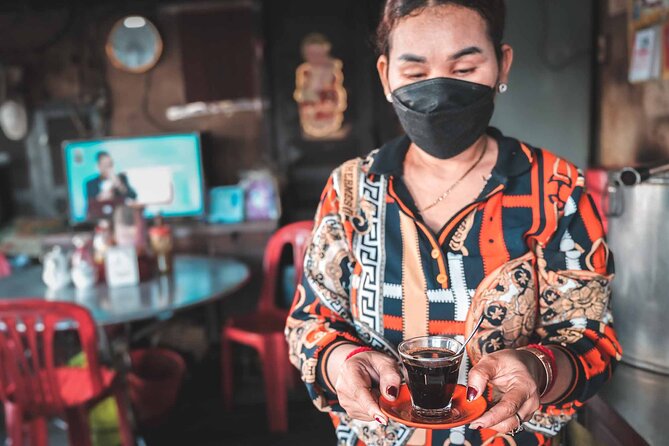 Phnom Penh Morning Market & Food Tour by Tuktuk - Includes All Food & Drinks! - Stop three: shopping and tasting at a wet market