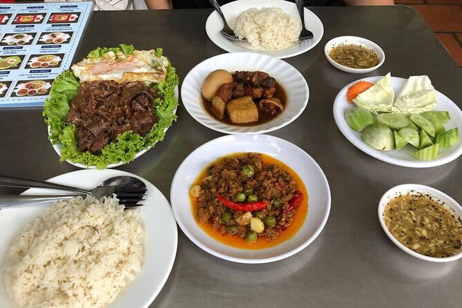 Phnom Penh Night City Highlights & Local Food tour by Tuktuk - The Royal Palace under evening lights