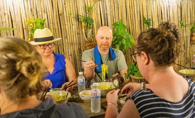 Phnom Penh: Night Foodie Tour by Tuk Tuk with Drinks - Lort Cha in a family-run back alley