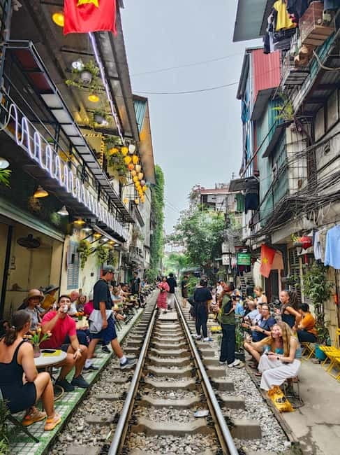 Private Half-Day Hanoi City Tour with Cyclo and Train street - Dong Xuan Market and Everyday Commerce
