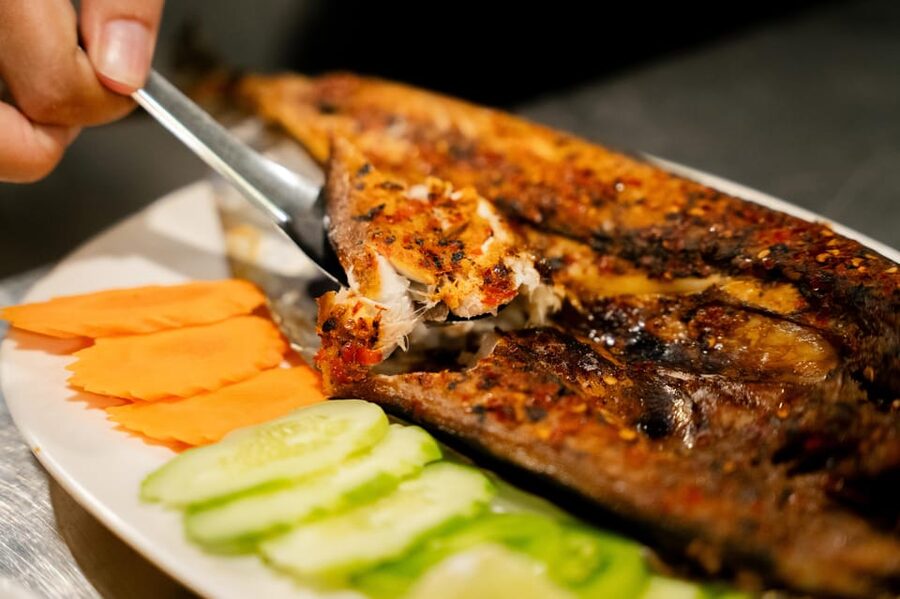 Siem Reap's Ultimate Street Food Tour by Tuk Tuk - A Cambodian-inspired cocktail in a garden setting
