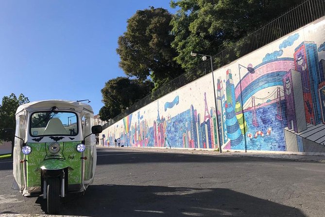 Tuk Tuk Lisbon: Exploring Urban Art - Vhils in a quiet passage