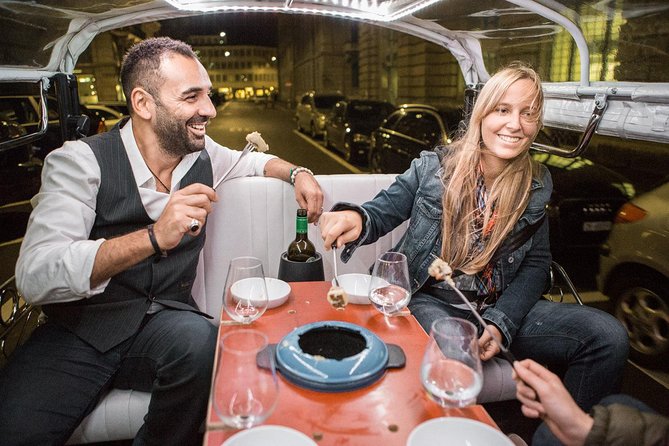 Zurich eTukTuk Private Tour - with Cheese Fondue and Wine - Fraumünster and Grossmünster across the Limmat